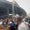 JUST IN: Residents scoop fuel as petrol tanker overturns on Lagos bridge